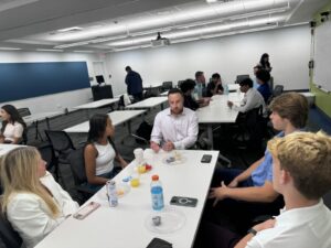 Zach working with students at the ACE panel