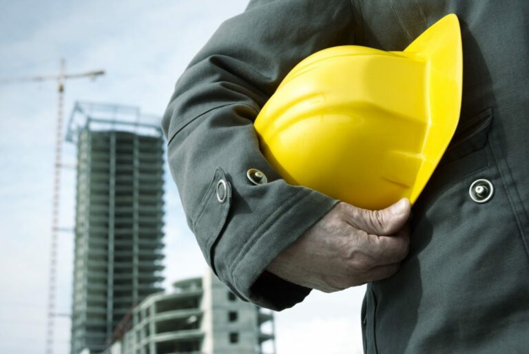 Person holding hard hat